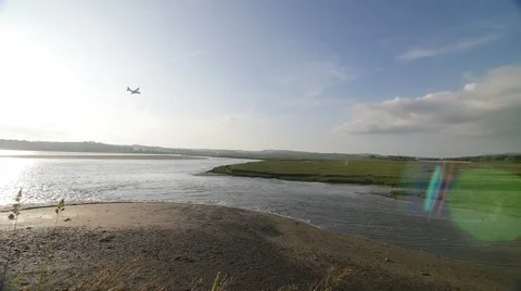 Slow Motion Plane flying over estuary Stock-Footage 65062301