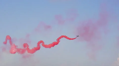 Slow motion of plane with red smoke Stock Footage 41870021