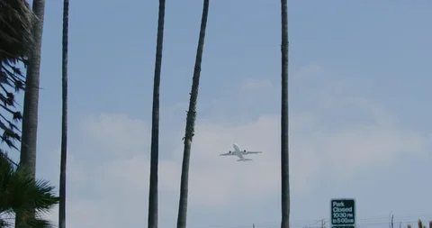 Slow motion of planes mid air from Dockweiler Beach in Los Angeles, California Stock Footage 115087046