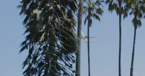 Slow motion of planes mid air from Dockweiler Beach in Los Angeles, California Stock Footage 115933366
