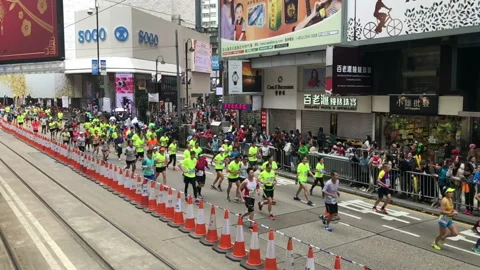 Slow motion-The players in Standard Chartered Hong Kong Marathon, China Vídeos de archivo 89611322
