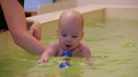 SLOW MOTION. Playing In A Pool Stock Footage 52688012