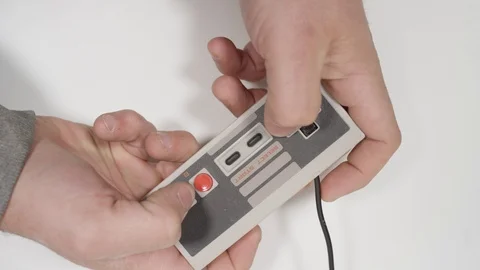 Slow motion playing video games on retro system Stock Footage 88332355