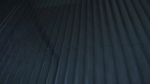 Slow motion of a pleated mosquito net on a window reveals fine vertical mesh Stock Footage 340956878