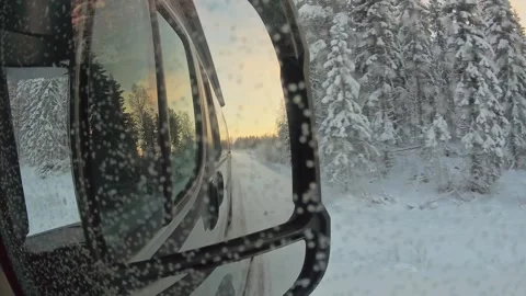 Slow motion Point of view van side mirror panorama of snowy forest and asph.. Stock-Footage 328371557