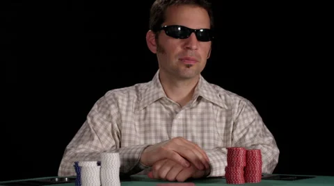 Slow motion of poker player looking at cards and then throwing them away Stock Footage