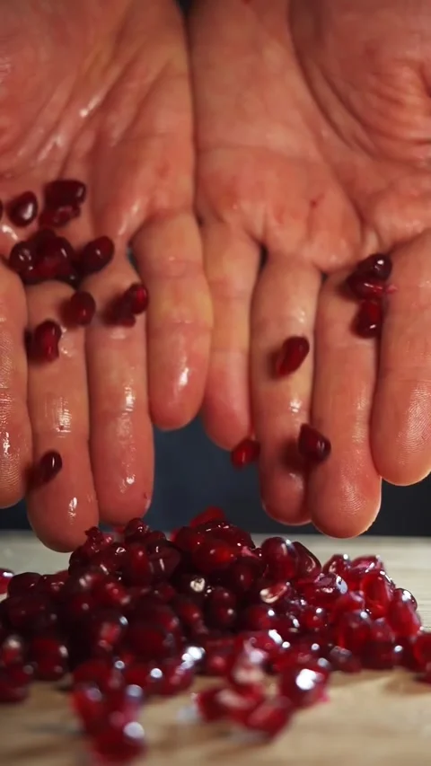 Slow motion of pomegranate grains falling, vertical video. preparing healthy Stock Footage 276419739