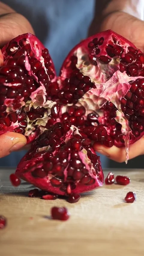 Slow motion of pomegranate grains falling, vertical video. preparing healthy Stock Footage 277103184