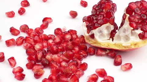 Slow Motion Pomegranate Seeds (Arils) Falling on White Background Stock Footage 319959690