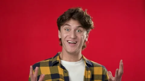 Slow motion portrait of amazed young man 20s shocked, saying WOW. Handsome guy Stock Footage 220731537