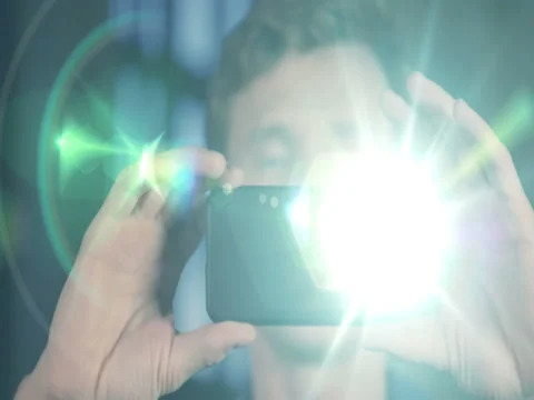 Slow Motion Portrait of Attractive Man Using Smartphone Camera Stock Footage 75634428