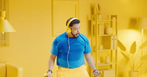 Slow motion portrait of bearded young man in sportswear doing exercises with Stock Footage 165869087