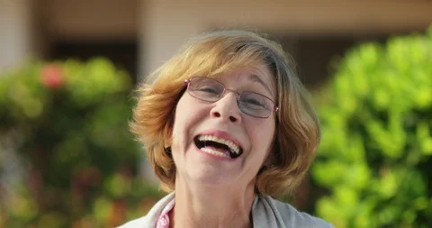 Slow Motion Portrait Close Up Smiling Senior Woman With Glasses Stock Footage 128718509