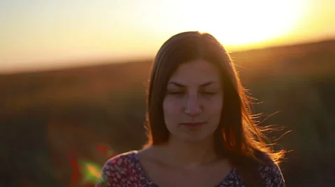 Slow motion portrait of a dark blond young woman calmly looking to the camera Stock Footage 68821631