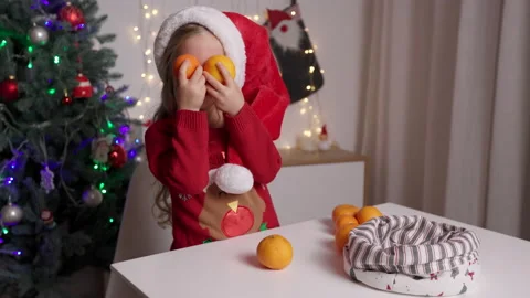Slow motion portrait of funny kid holding in hands oranges on the background of Stock Footage 166466162
