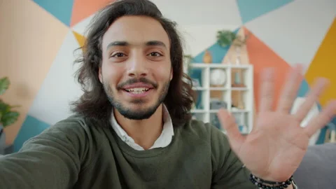 Slow motion portrait of handsome Arab man looking at camera talking and showing Video stock 135257013