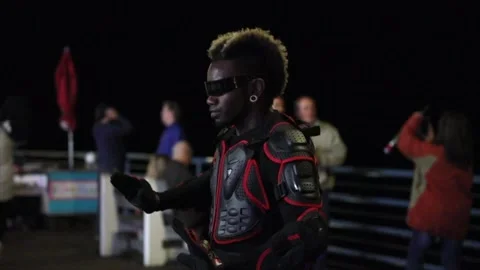 Slow motion portrait of a man of colour dancing/peforming for the people. Stock Footage 135797929