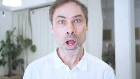 Slow Motion Portrait of Middle Aged Man in Shock, Wondering Video stock 88116780