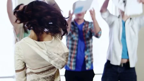 Slow motion portrait of students throwing up papers and notes Stock Footage 80227450