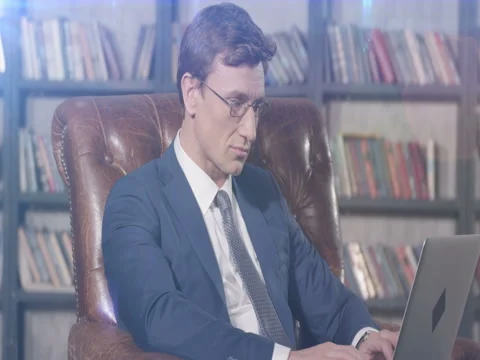 Slow Motion Portrait of Successful Hacker with Glasses Working with Laptop Video stock 76020156