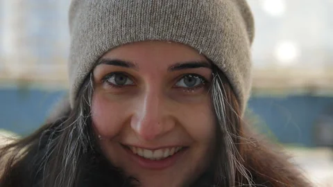 Slow motion portrait of young happy woman in a winter cityscape. Stock Footage 102440525