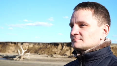 Slow motion portrait of young man who enjoy sunny day in nature at winter time Stock Footage 89616050