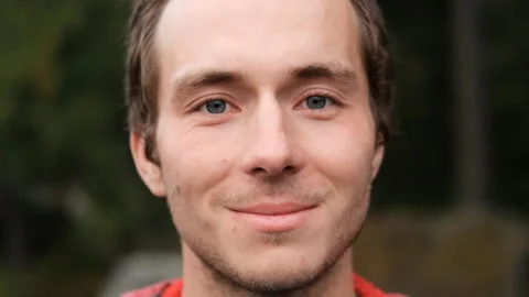Slow motion portrait of a young man with bristles smiling. Stock Footage 147400524