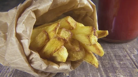 Slow motion potatoes in a package sprinkle with salt Stock Footage 96210892