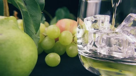 Slow motion pour bourbon into a glass of ice Stock Footage 91978704
