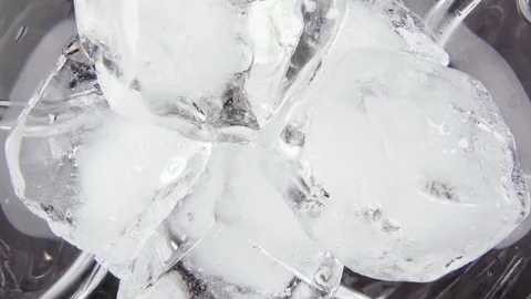 Slow motion pour a drink into a glass top view Stock Footage 100891809