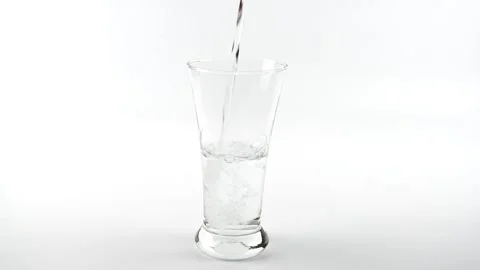 Slow motion of pour pure drinking water into a glass with white background. Stock Footage 170018605