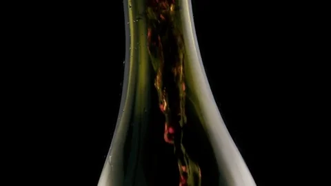 Slow motion. Pour red wine into the bottle Stock Footage 75956180