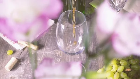 Slow motion pour some wine into the glass in the background Video stock 94078638