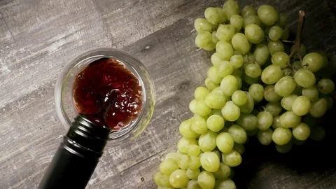 Slow motion pour the wine from the bottle into the glass and appetizer top view Stock Footage 93698964