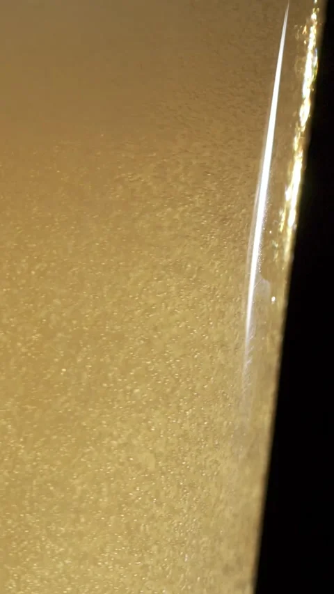 Slow motion pouring of beer with bubbles and foam in a glass Stock Footage 340482711