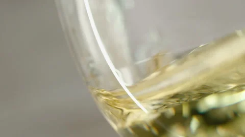 Slow motion of pouring cider from bottle into glass. Stock Footage 147346433