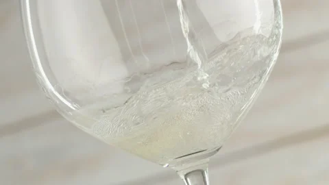 Slow motion of pouring cider from bottle into glass. Stock Footage 147346621