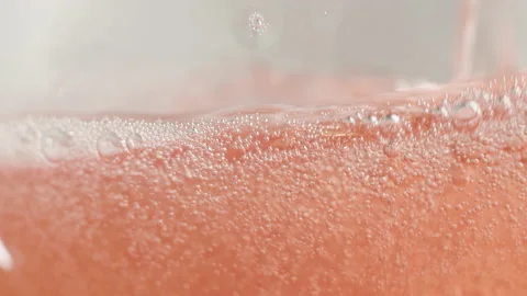 Slow motion of pouring cider from bottle into glass. Stock Footage 147347375