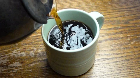 Slow motion pouring of coffee Stock Footage 88890951