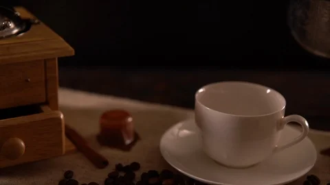 Slow motion pouring coffee from a silver pot Stock Footage 95203324