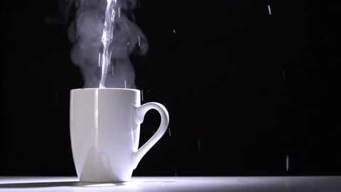 Slow motion of pouring hot water into a white porcelain tea cup Stock Footage 143257549