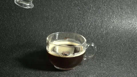 Slow Motion Pouring Milk Or Coffee Creamer In Black Coffee. Closeup View. Mal Stock Footage 131745234