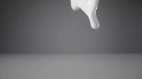 Slow motion of pouring milk stream, macro shot. Stock Footage 127267706