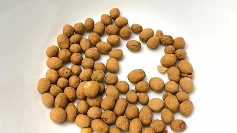 Slow-motion of pouring peanuts snack Stock Footage 256696050