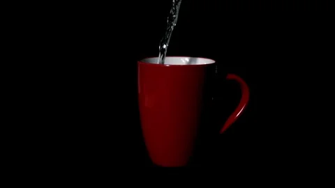Slow-motion, Pouring water into a drinking glass. Close up slow motion pourin Stock Footage 265845529