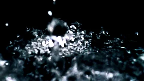Slow-motion, Pouring water into a drinking glass. Close up slow motion pourin Stock Footage 265847556
