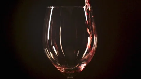 Slow motion pouring wine into glass Stock Footage 157536498