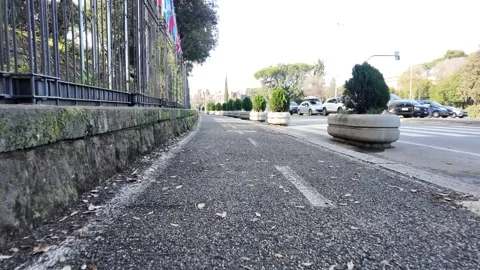 Slow Motion POV Of Cycling Path Through Ancient Roman Park Vídeos de archivo 330123510
