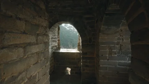 Slow-Motion POV Moving from Inside a Great Wall Watchtower Toward an Arched Stock Footage 342443178