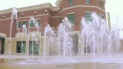 Slow motion. POV point of view - Plaza with small jet fountains at Southglenn. Stock Footage